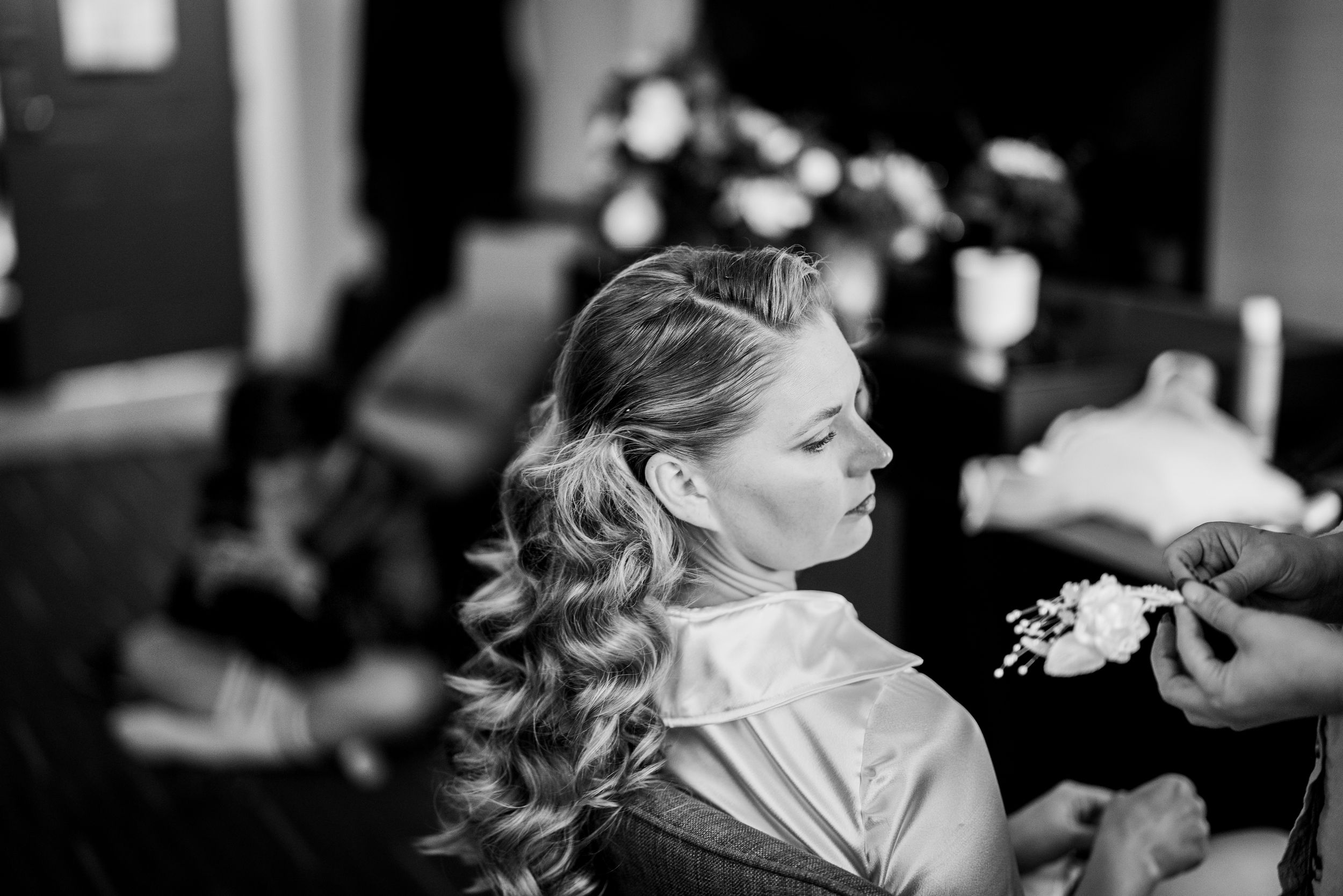 A black and white collage of wedding photos showing romantic moments between a bride and groom.
