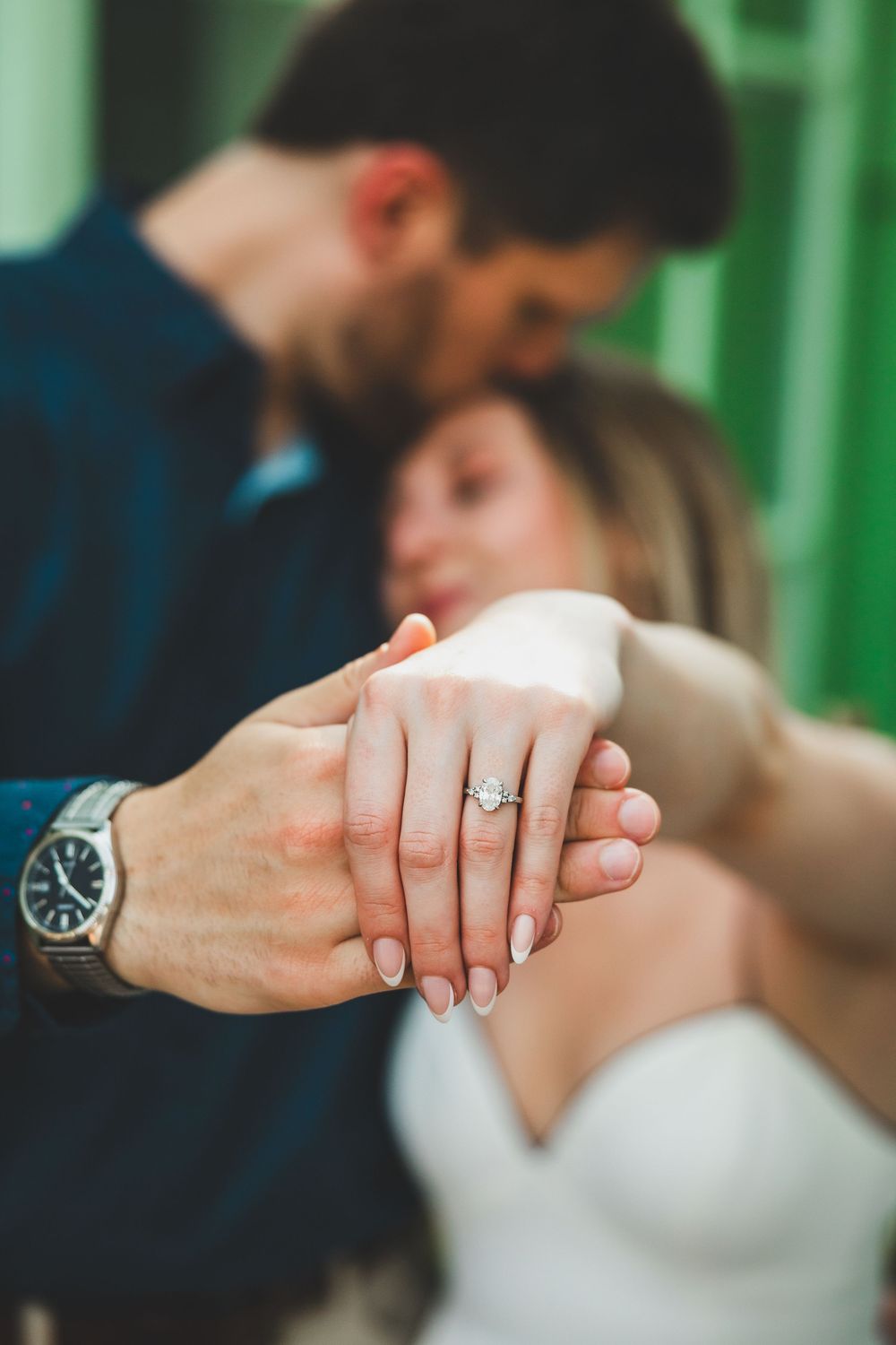 Close-up of Hannah’s engagement ring as she holds Connor’s hand during their Georgetown engagement session with candid natural lighting.