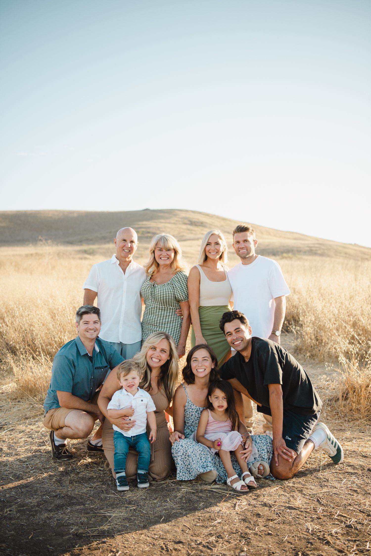 extended family photo in the middle of a beautiful golden field in southern california