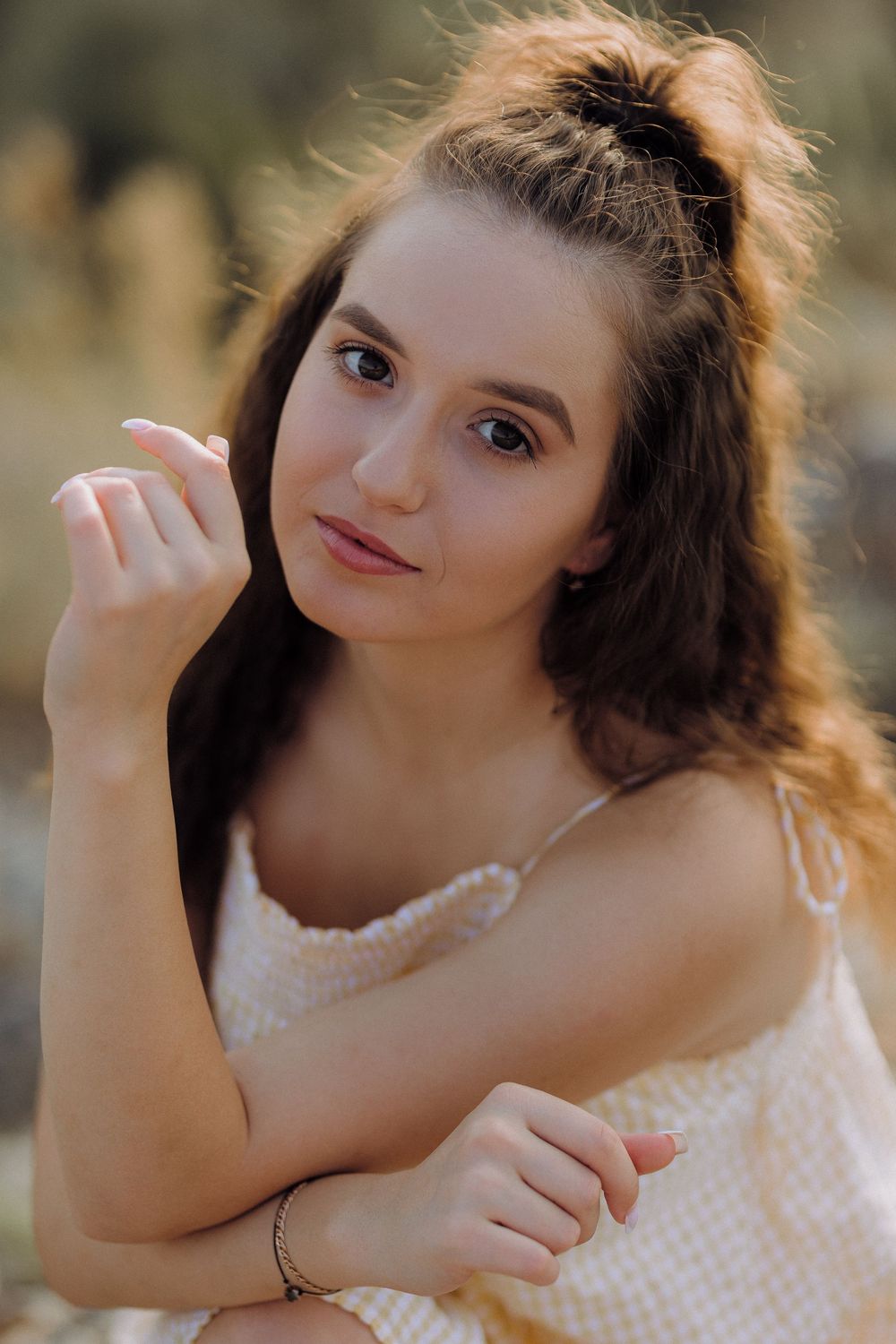 Close-up portrait series showing joyful expressions and natural poses in warm golden lighting.