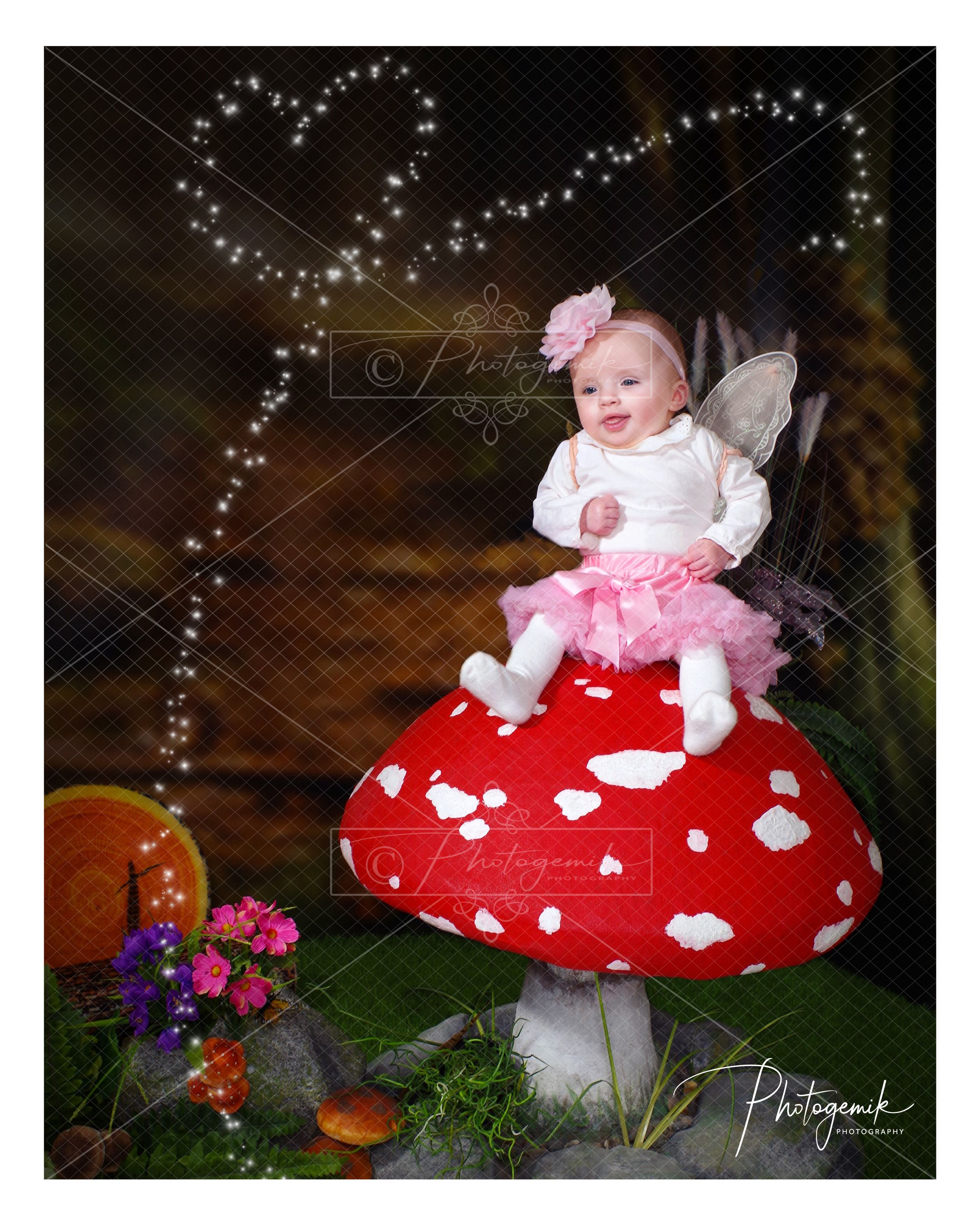 Cute Fairy Sitting On Giant Toadstool. The Enchanted Forest Fairy Photo Shoot. Photogemik Photography Studio Bradford.