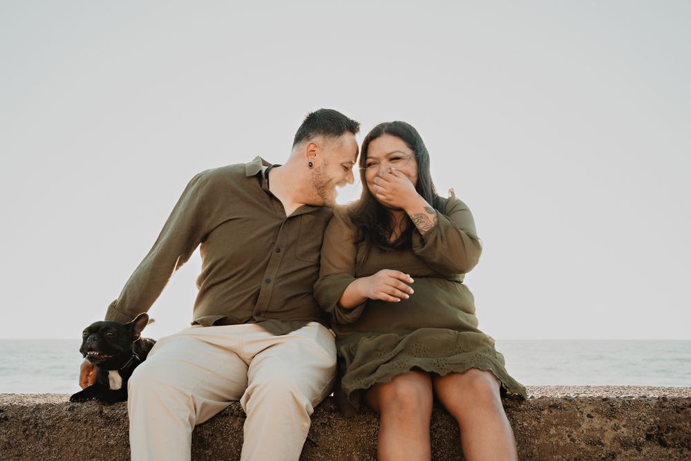 Parents laughing and having fun in the relaxed beach atmosphere
