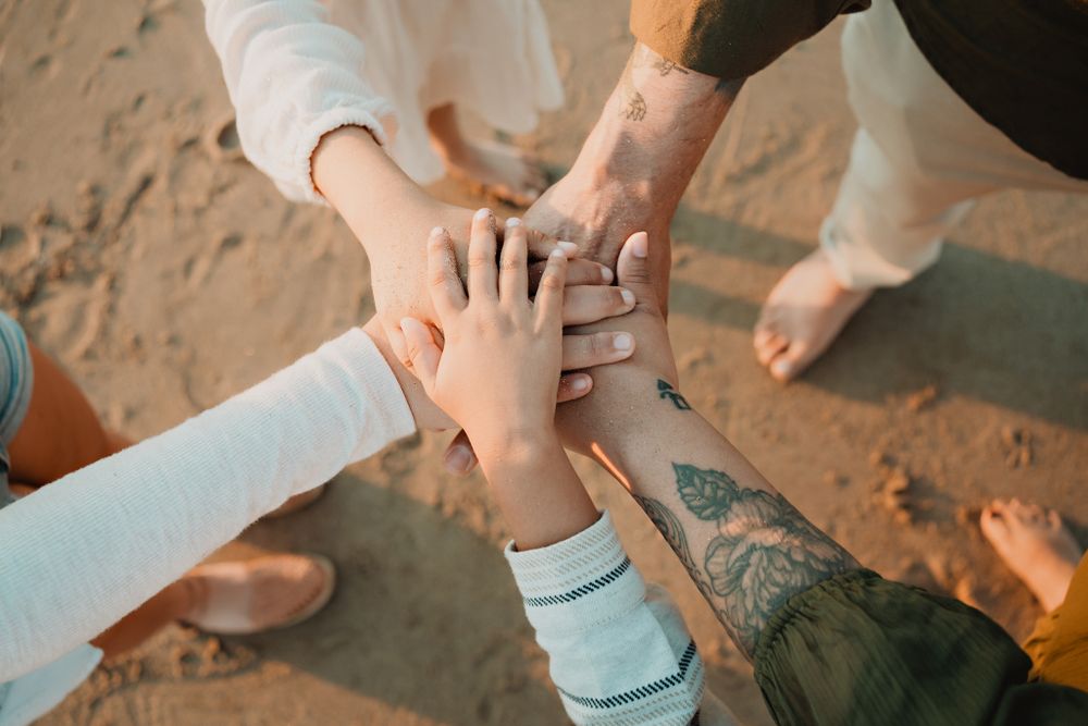 Close-up of the family holding hands, a symbolic gesture of unity on their Mazatlán day