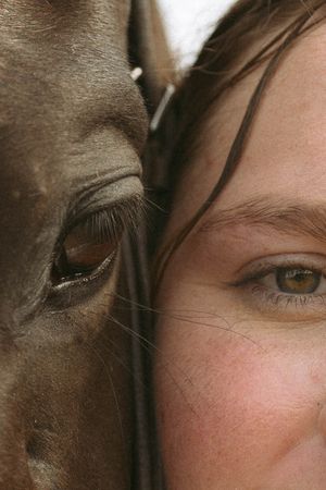 Artistically cropped extreme close-up photograph showing fragments of eyes and face in a repeating pattern.