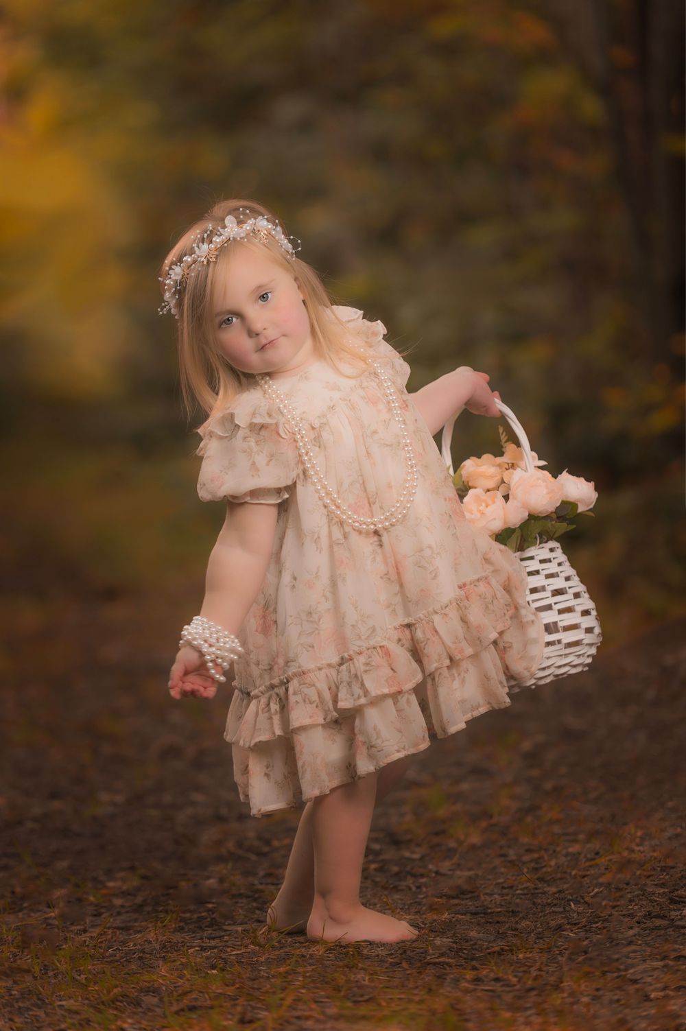 Ethereal autumn portrait in vintage lace dress with woven basket prop.