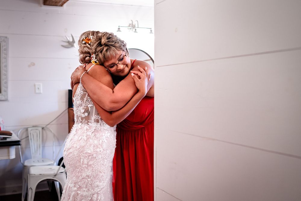 Intimate pre-wedding moments with bridesmaids in red dresses.