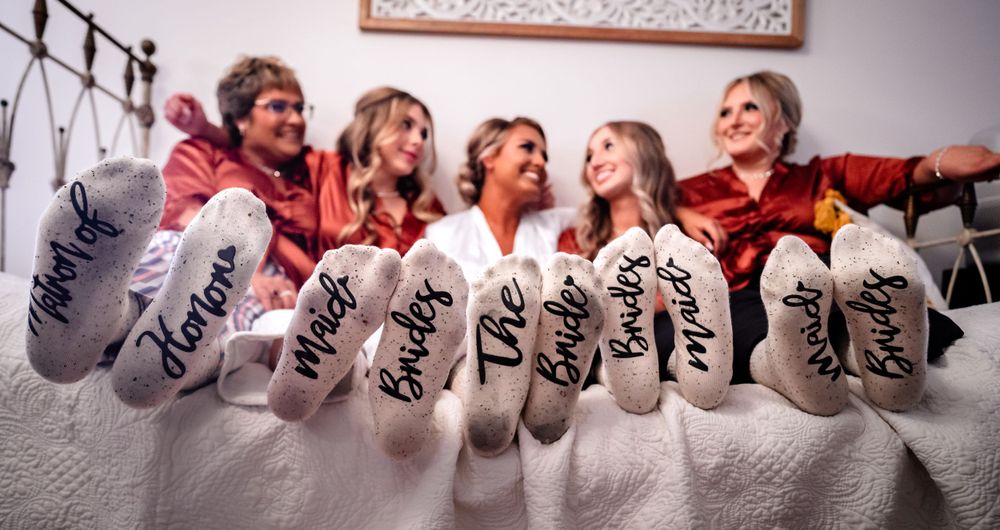 Creative lineup of personalized wedding shoes arranged in a row.