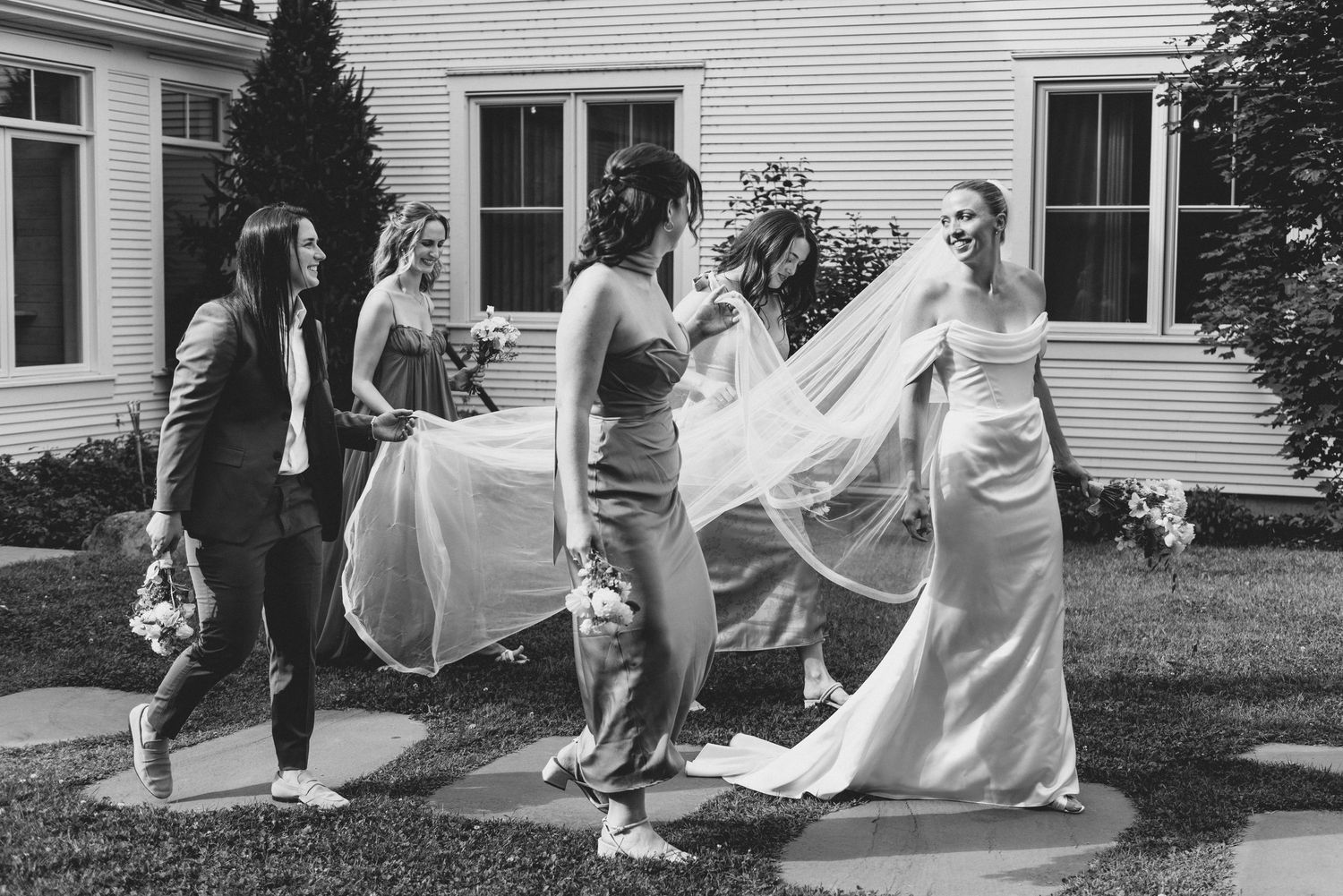 A sequence of wedding photos shows a bride's dress flowing in the wind as she moves outside a white house.