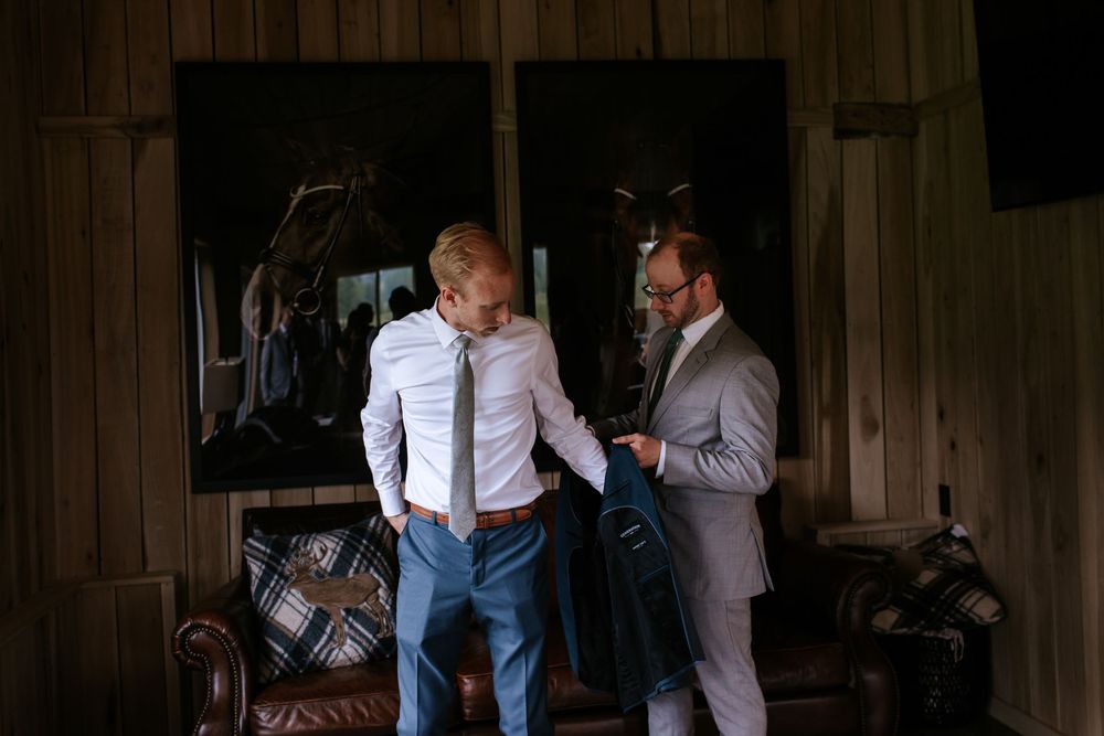 Group preparing in a rustic wooden room with natural lighting.