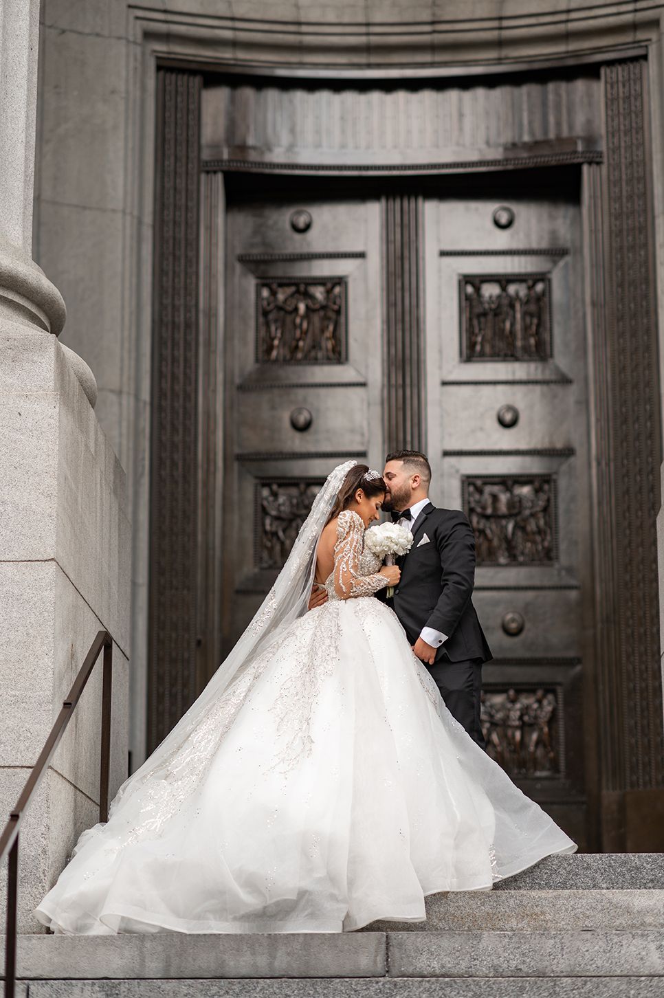 Romantic wedding photography sequence showing couple in formal attire on grand stone steps.