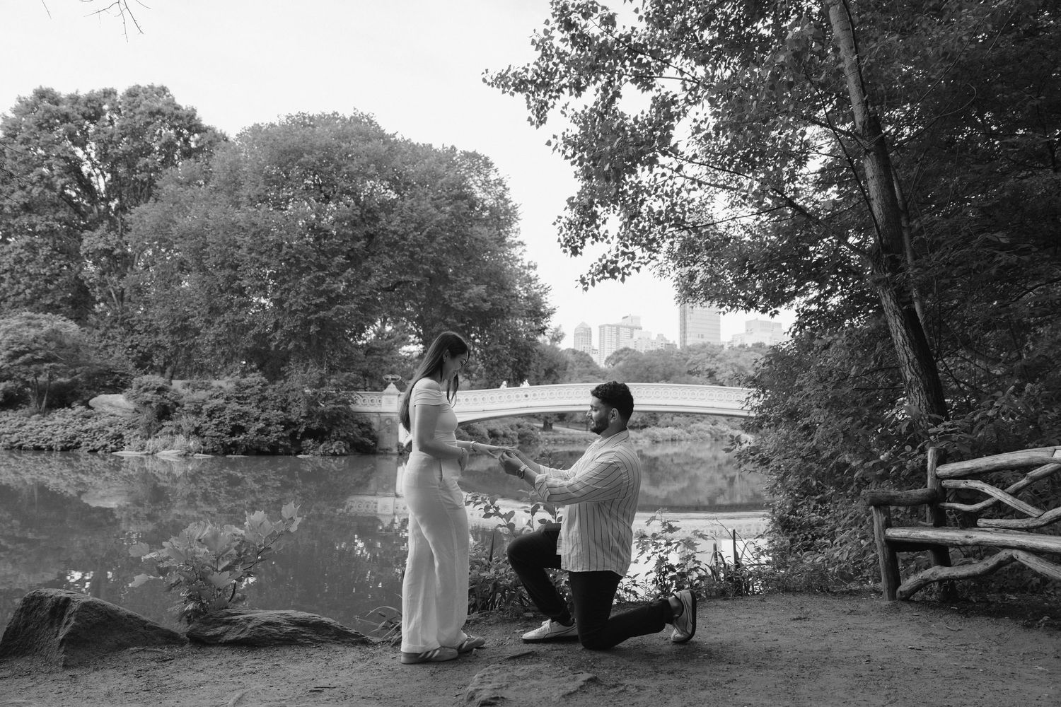 Black and white landscape series showing a romantic outdoor photoshoot in a natural setting.