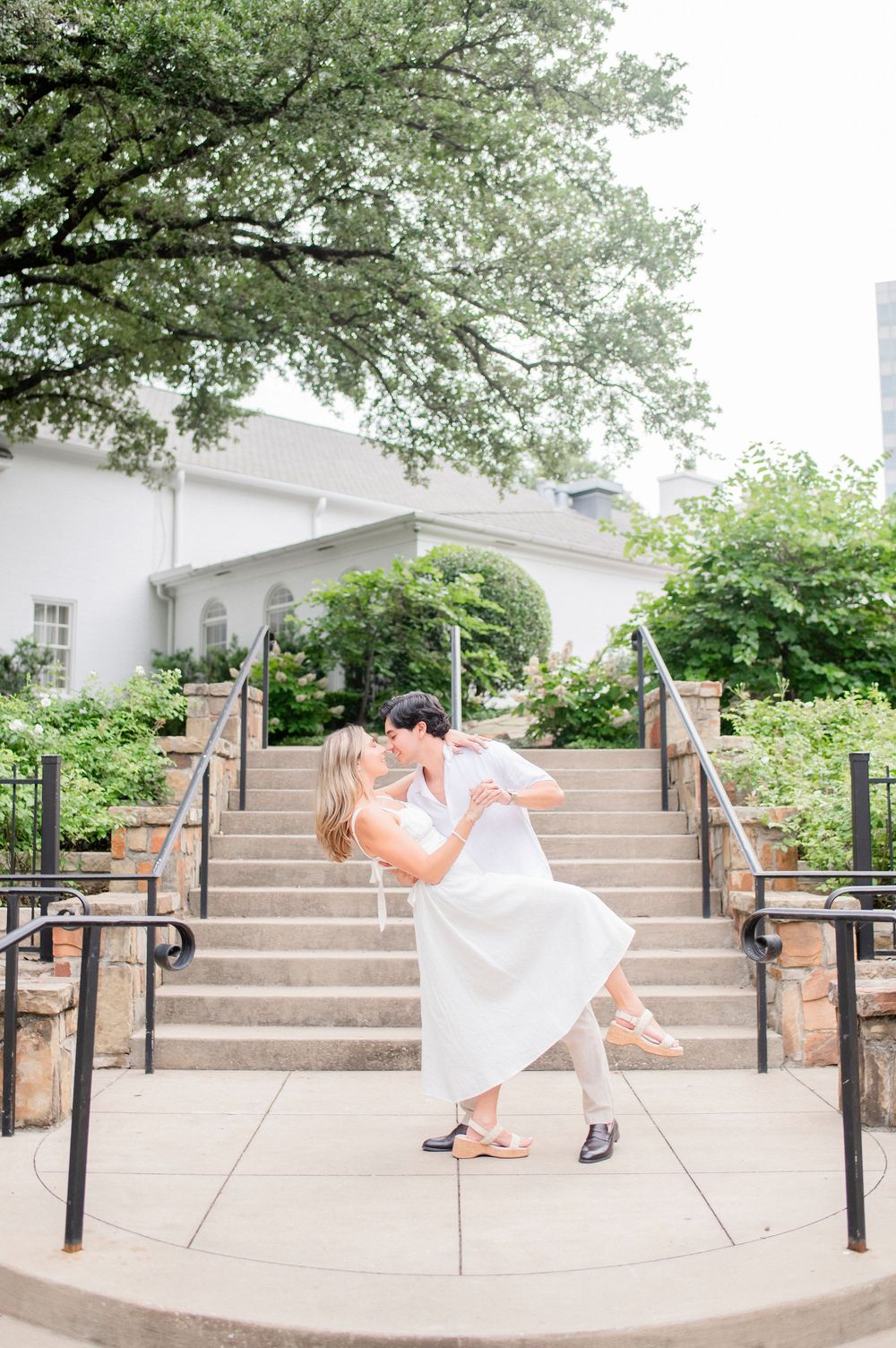 A series of photos showing a person in a white dress performing graceful dance poses on outdoor concrete steps.