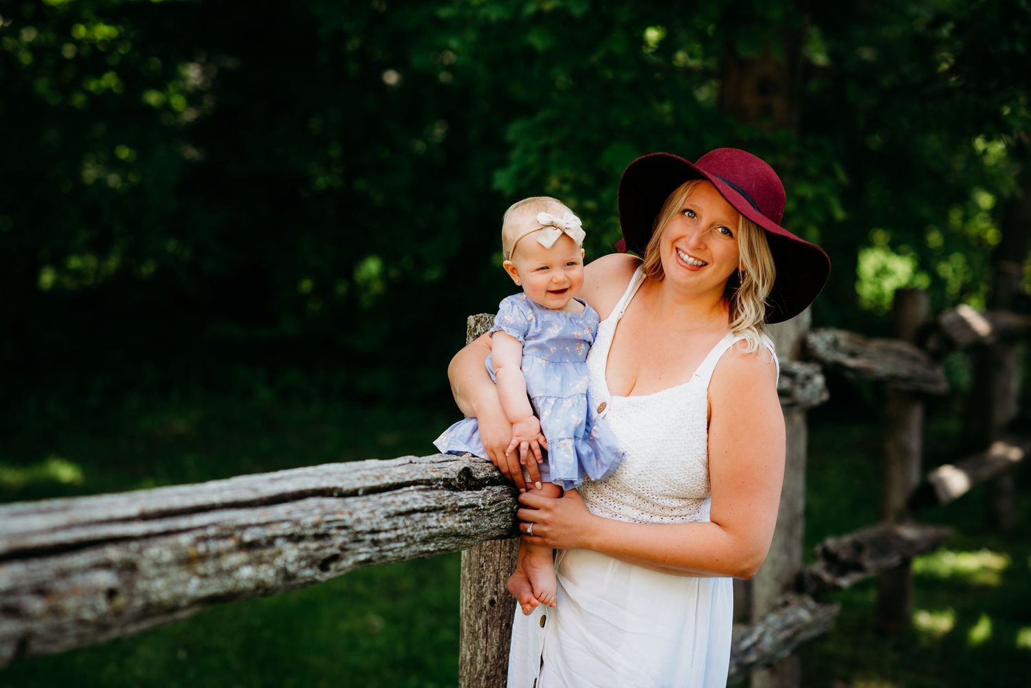 Mother and infant daughter photographed outdoors during a Mother’s Day session in Ontario.
