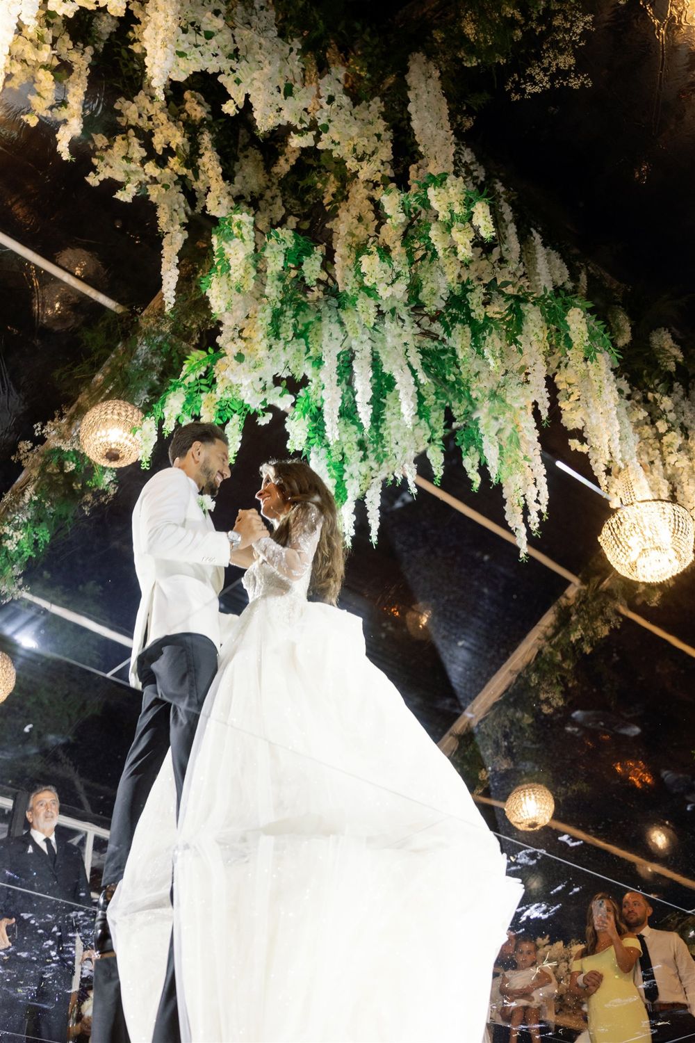 Bride and groom dancing together at their destination wedding on Isola del Garda