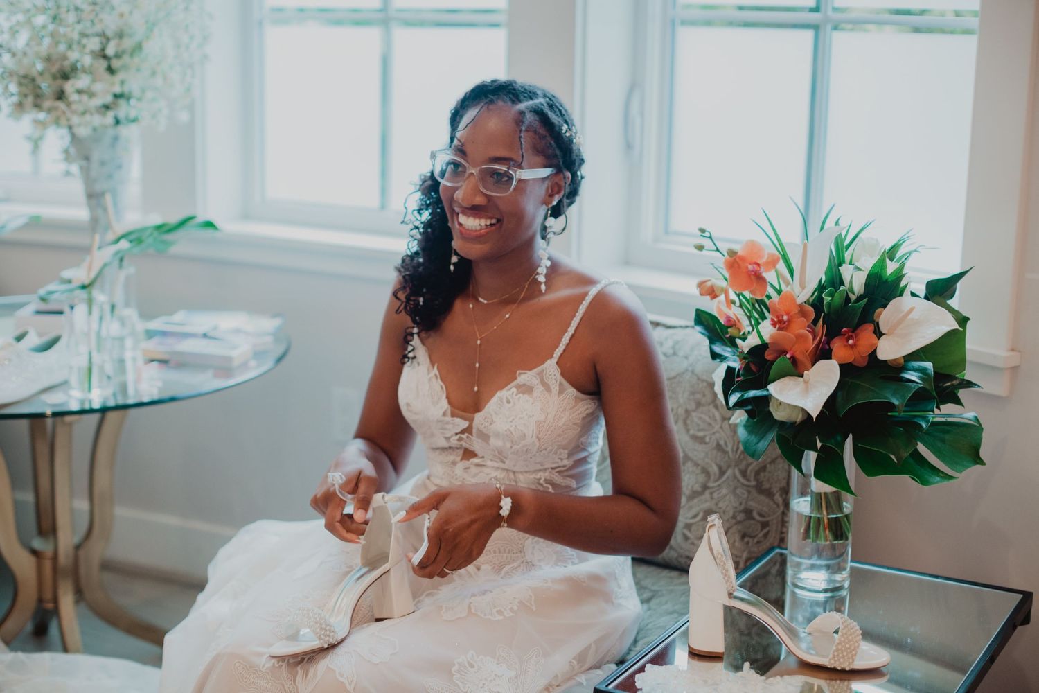 Bright indoor wedding preparation space with natural light streaming through windows.