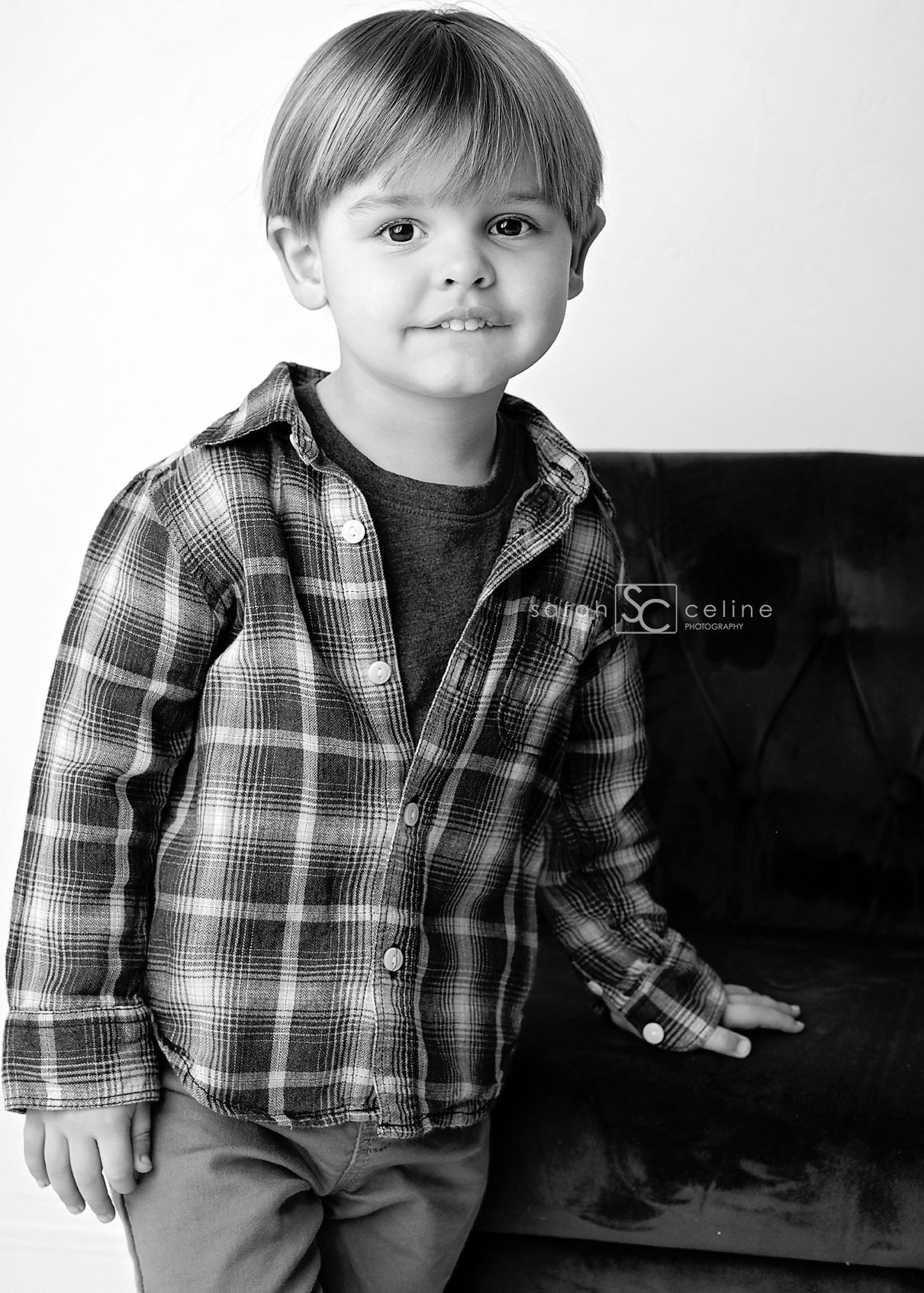A black and white photo series shows a child in a plaid button-up shirt posing against a dark background.