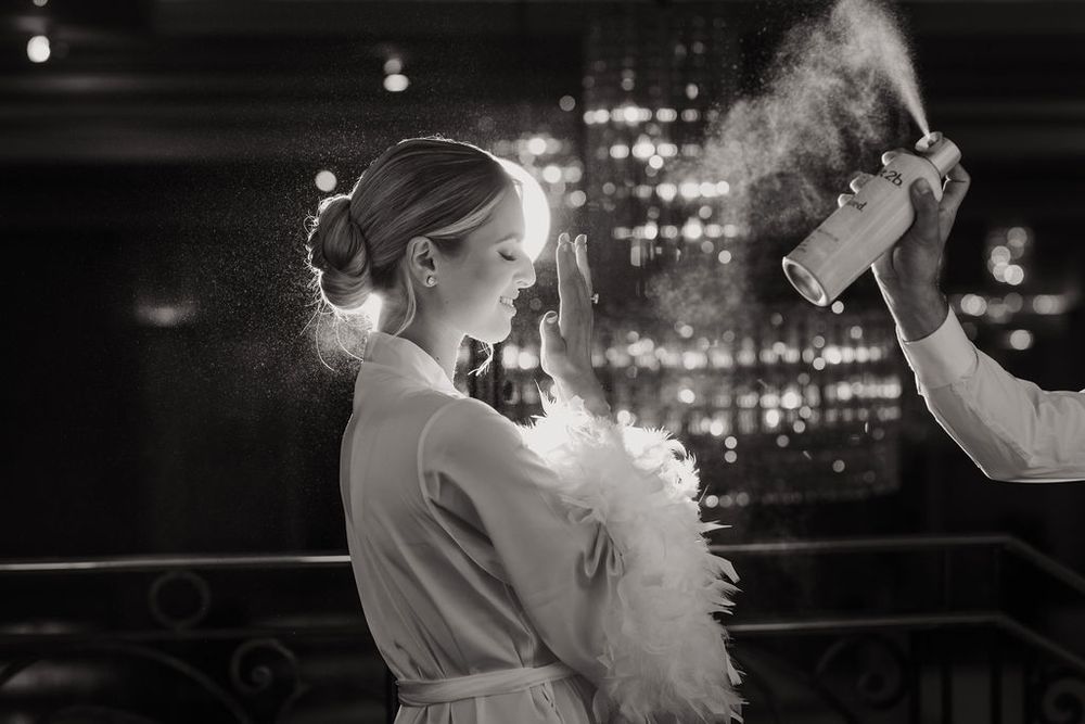 A romantic black and white photo series showing a couple dancing together in an elegant setting.