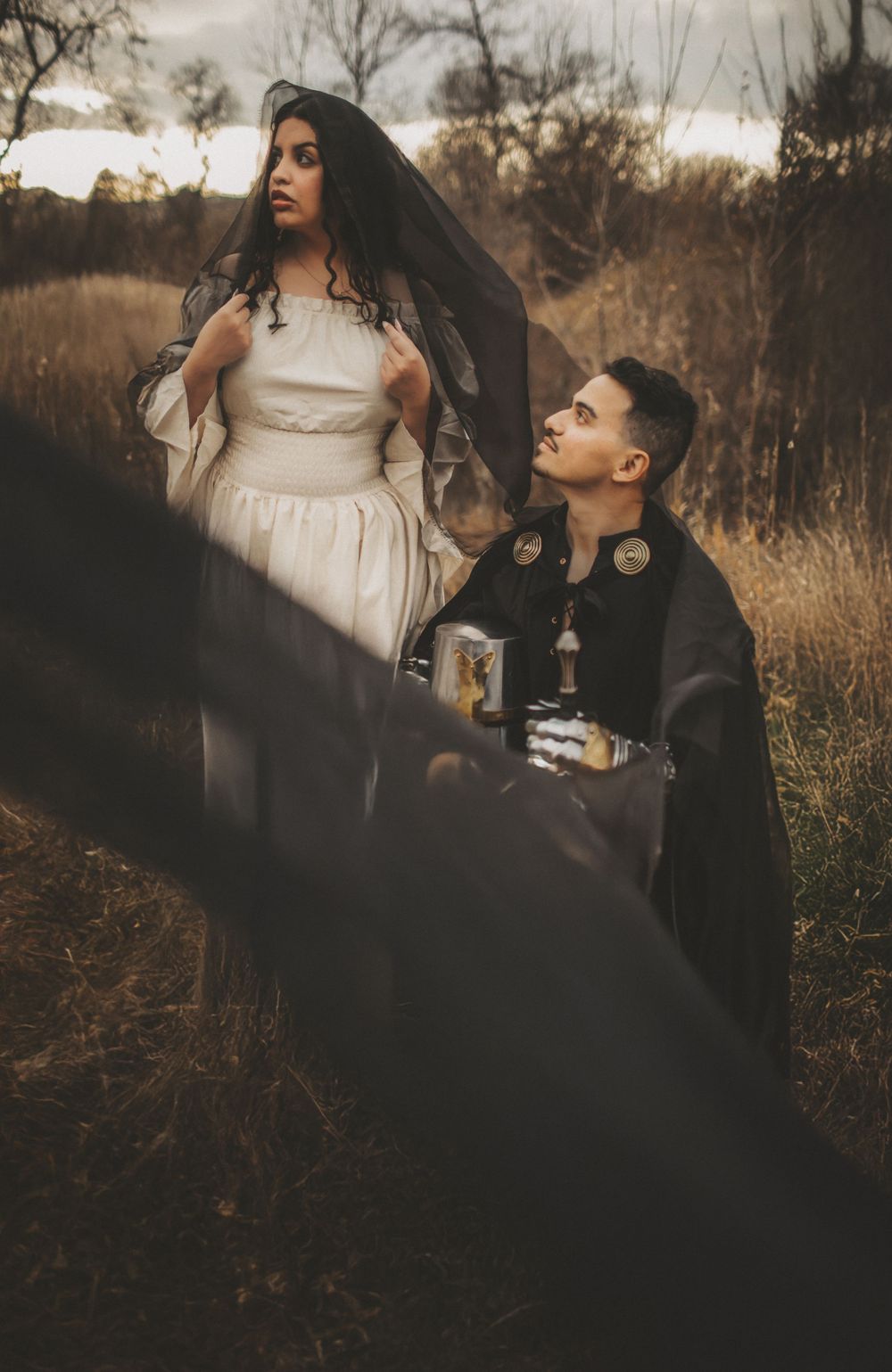 Cinematic couple portrait outdoors, capturing an intimate moment between partners in warm, earthy tones with a storytelling style