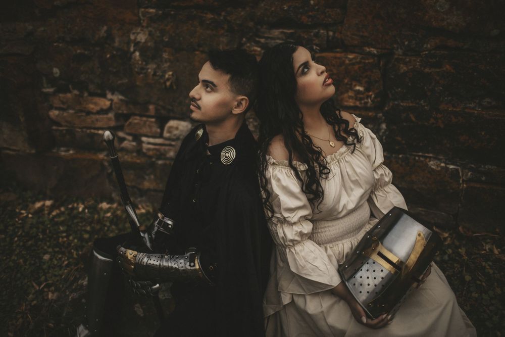 Couple portrait in moody, cinematic style against textured wall in Northern Colorado by Sól Dreki Photography