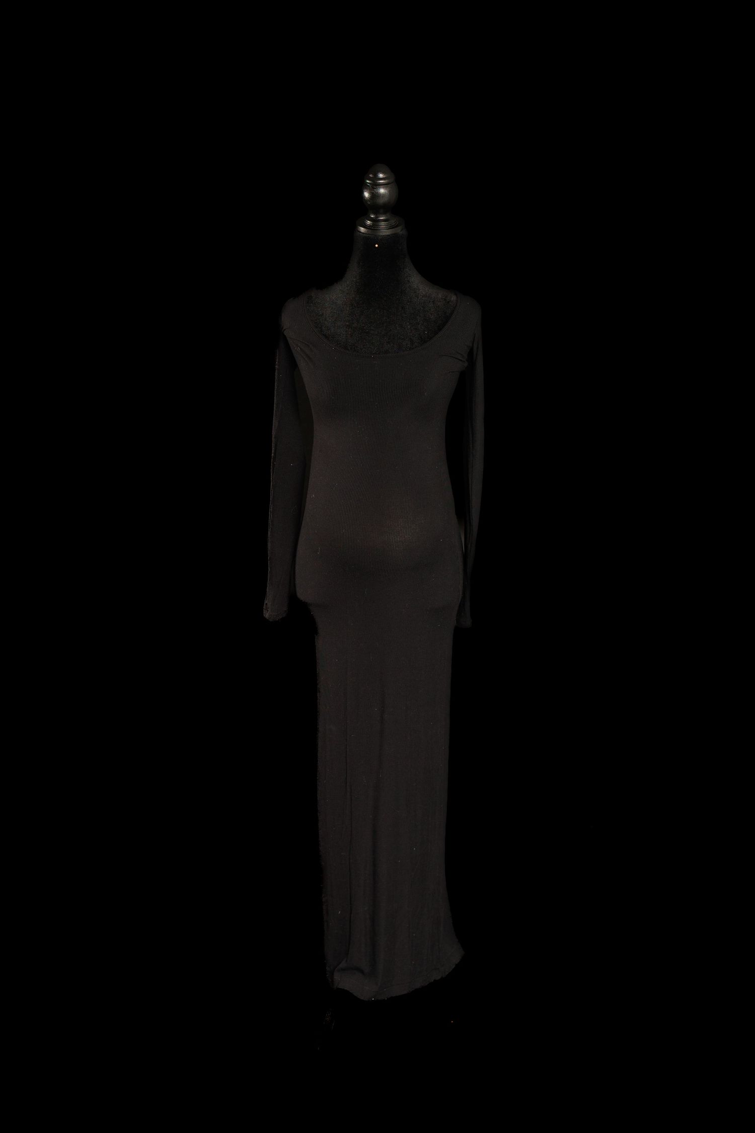 Black long sleeve maternity gown with scoop neckline and body-skimming silhouette on mannequin