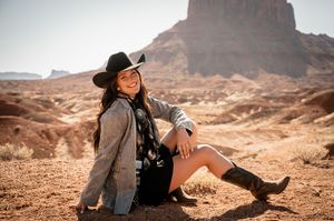 Desert landscape photography session with red rock formations and dramatic scenery.