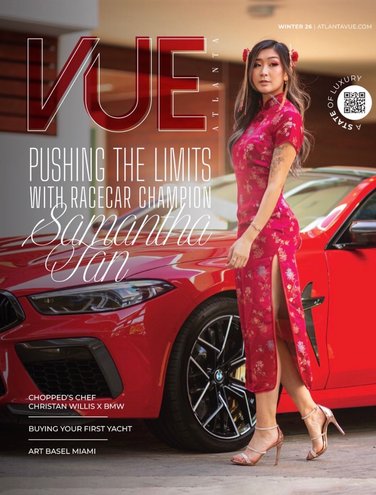 Luxury lifestyle photoshoot featuring a red sports car and elegant pink dress against an upscale interior setting.