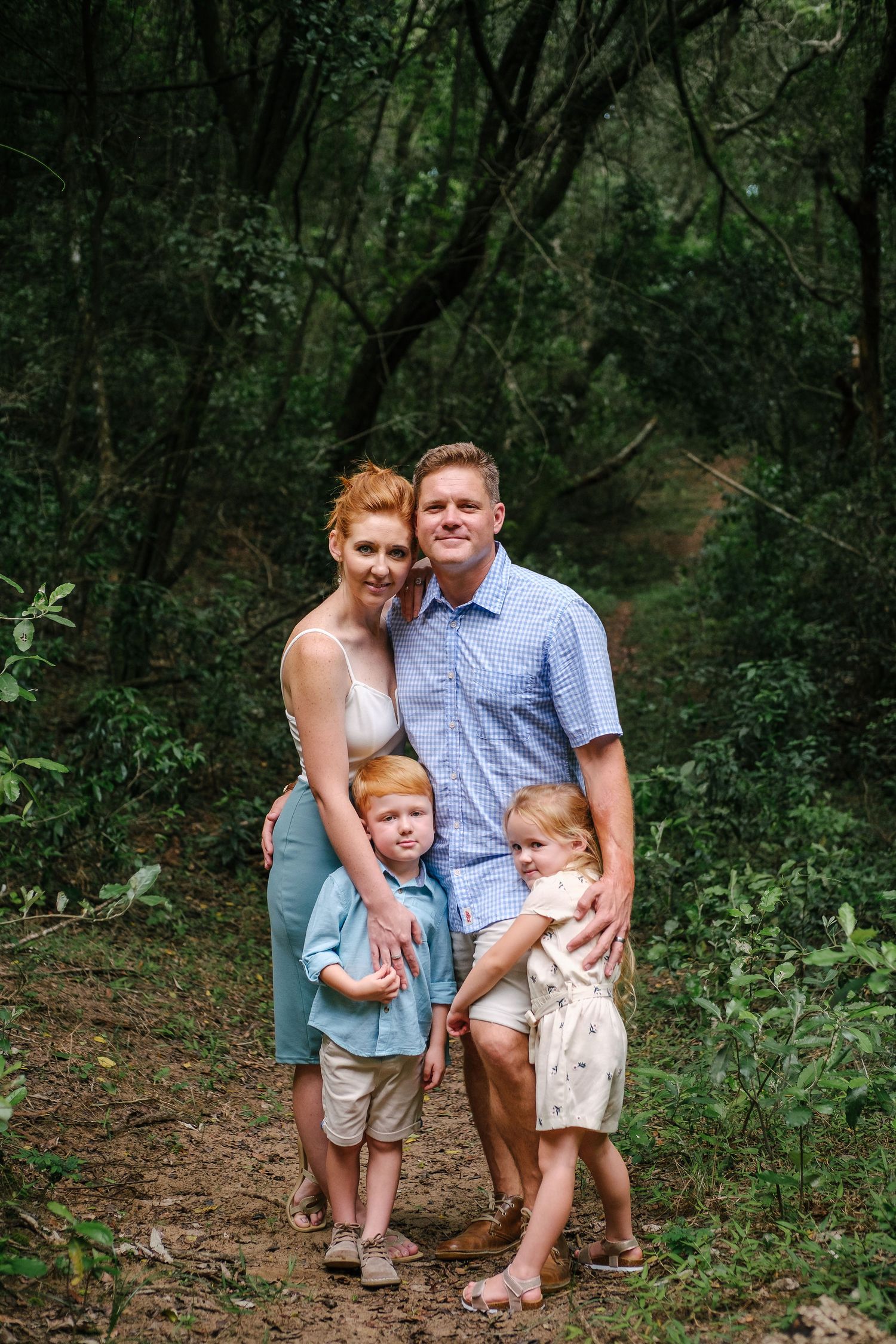 Natural family photoshoot of a family of four in a forest setting, photographed by Abigail Smith Photography in Mtunzini, South Africa