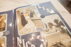 Wedding album page showing vintage photographs in sepia tones.
