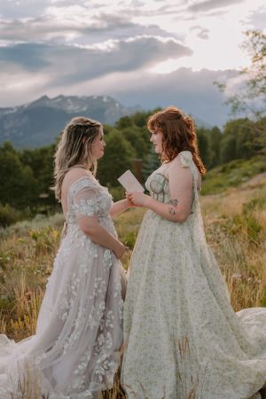 Emma reads her vows to Victoria in an intimate elopement ceremony in Colorado.
