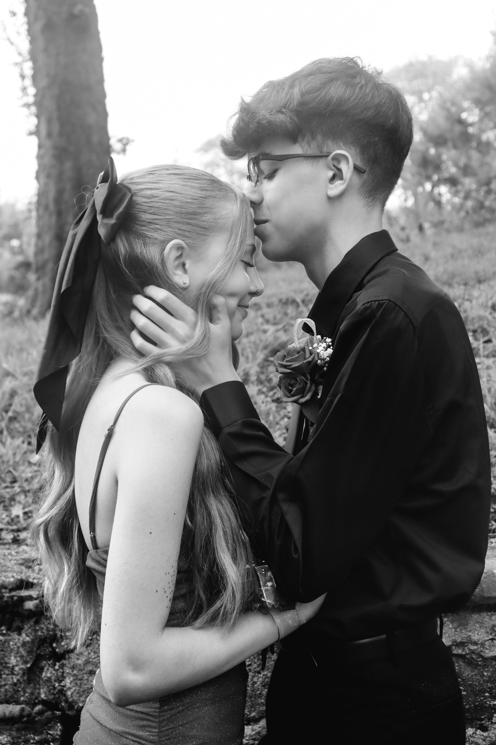 A series of black and white romantic photos showing an intimate couple's embrace in different angles.