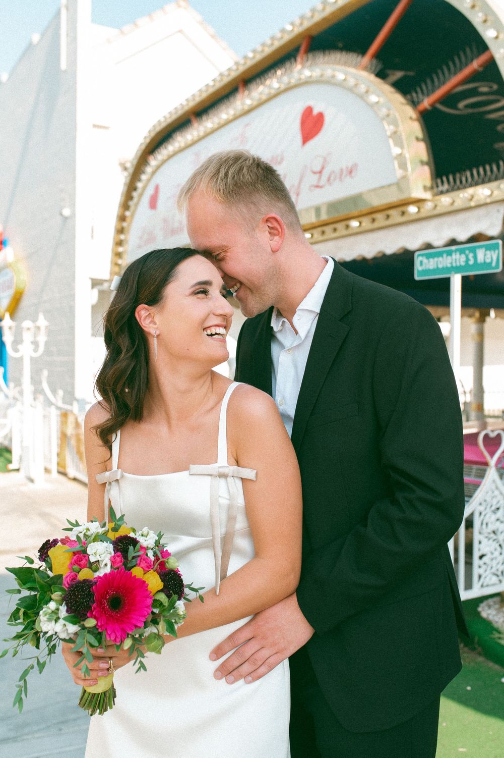 Pink cadillac elopement at Little White chapel