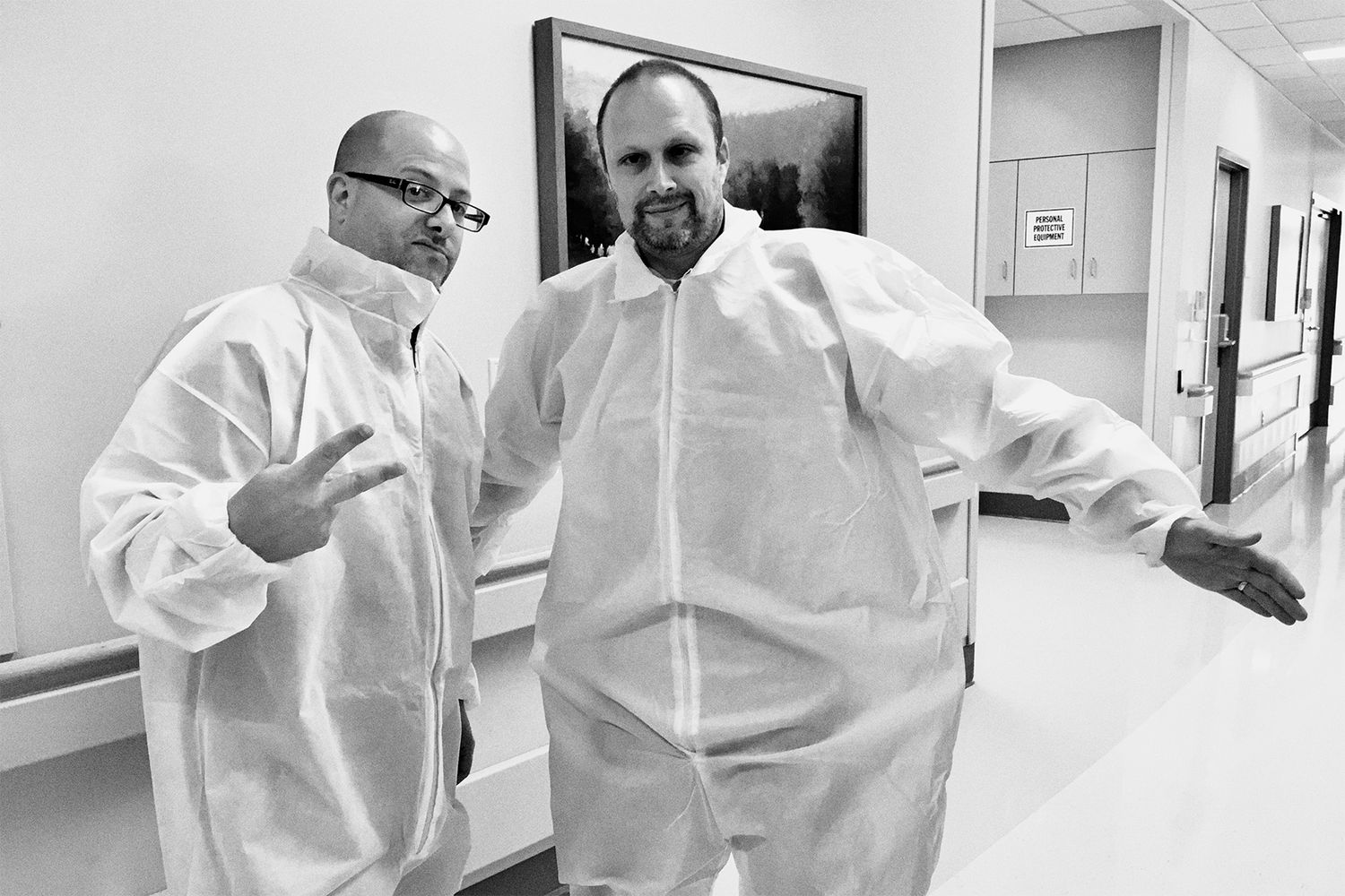John Magnoski with his client dressed in medical protective suits during a commercial photo & video shoot in St. Paul, MN.