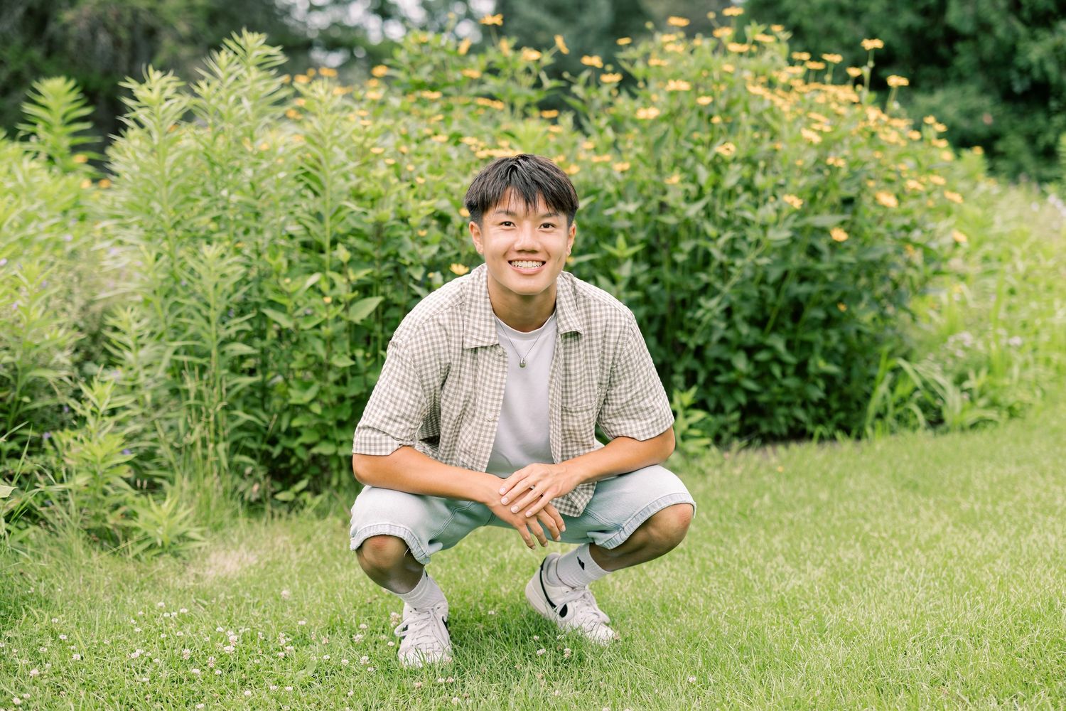 A series of cropped photos showing someone sitting on lush grass in a sunny garden setting.