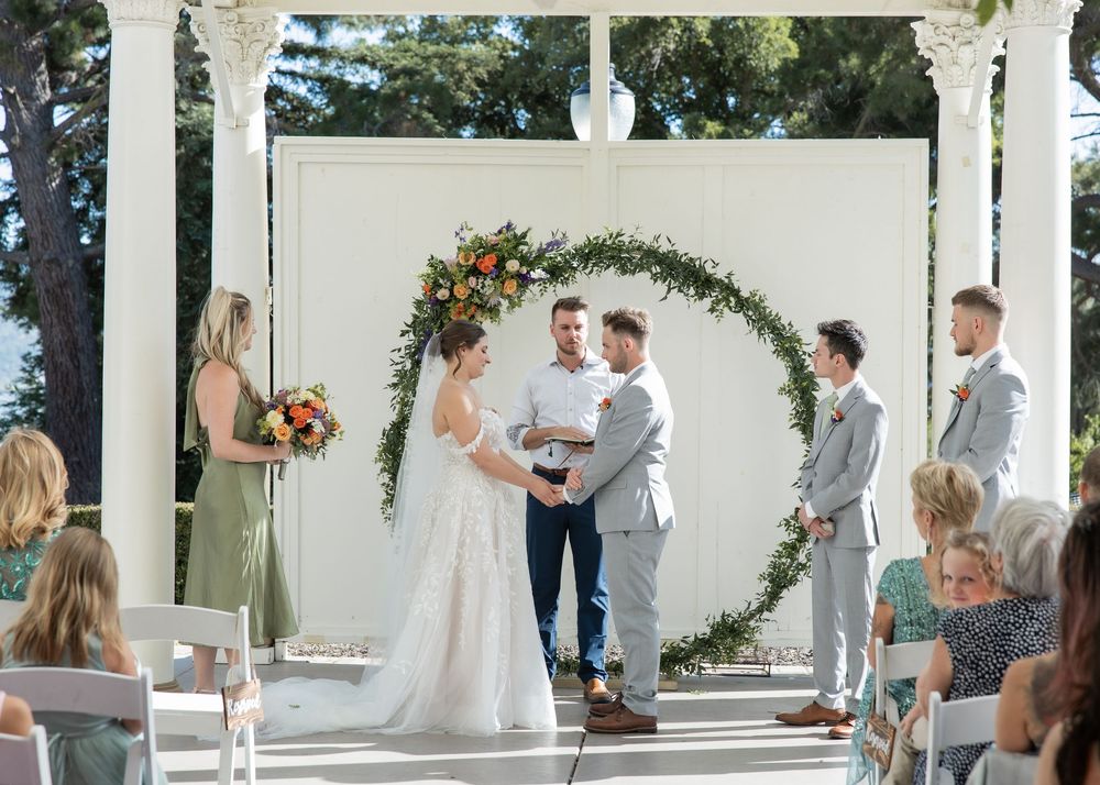Couple exchanging vows on Jefferson Street Mansion garden terrace