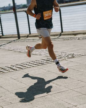 Close-up sequence of running feet and shadows on a paved surface showing movement progression.