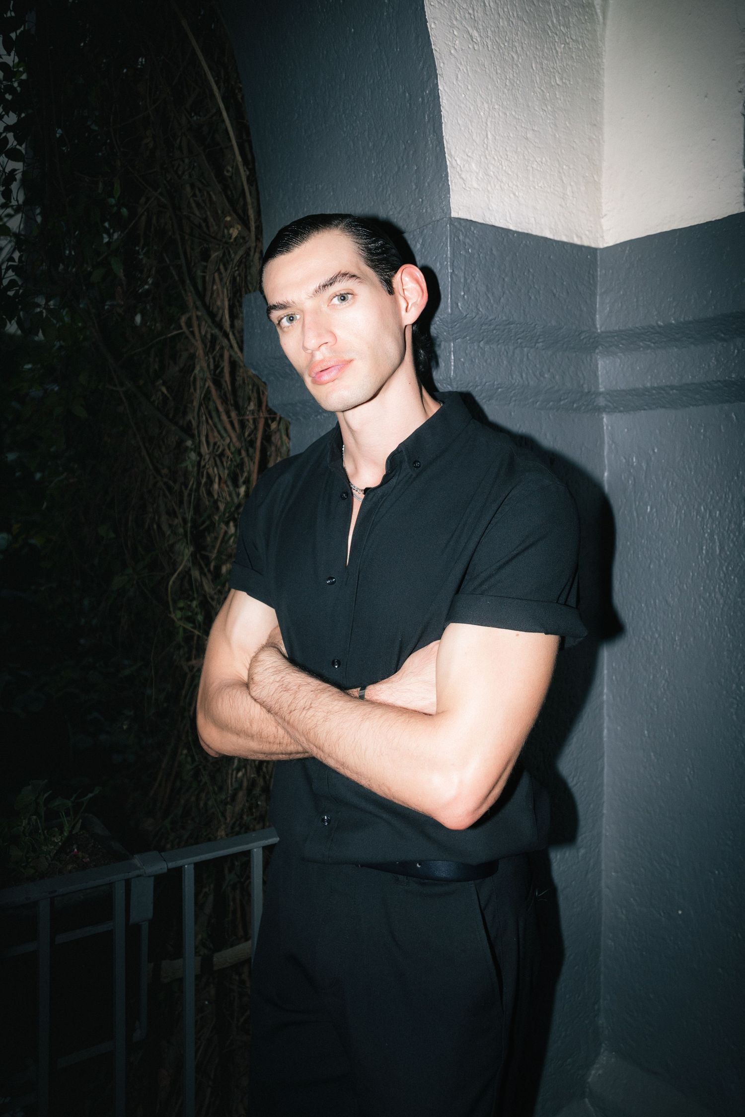 Portrait of male model in sleek black outfit | Editorial fashion photography by Dario Hudon, Le Café Studio