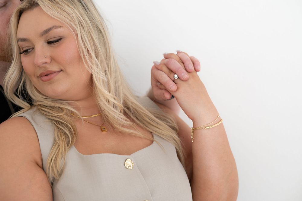 Close-up shots of someone wearing delicate jewelry against white background.