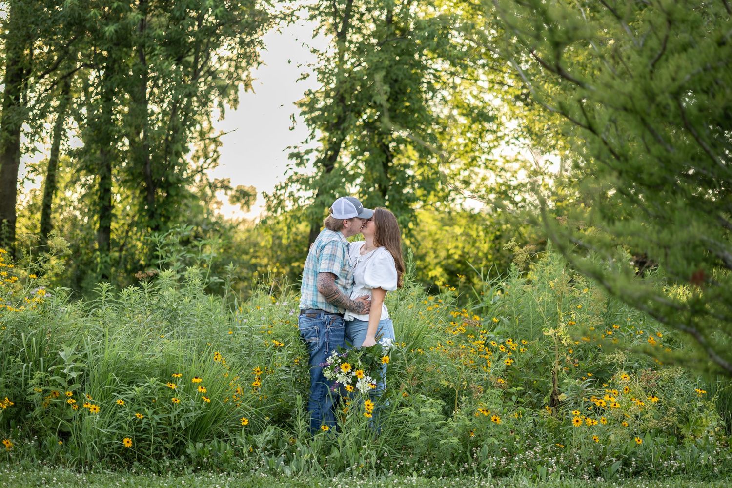 Springfield, IL Photographer captures a couple in a wildflower field at Centennial Park in Central, IL