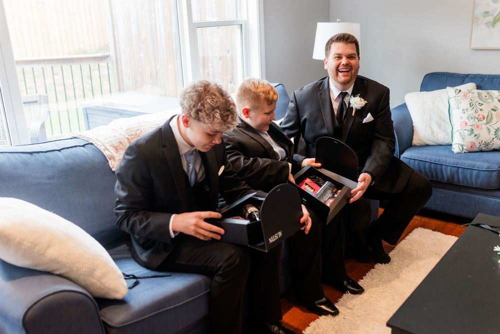 Students collaborating together on a couch while relaxing in a casual office setting.