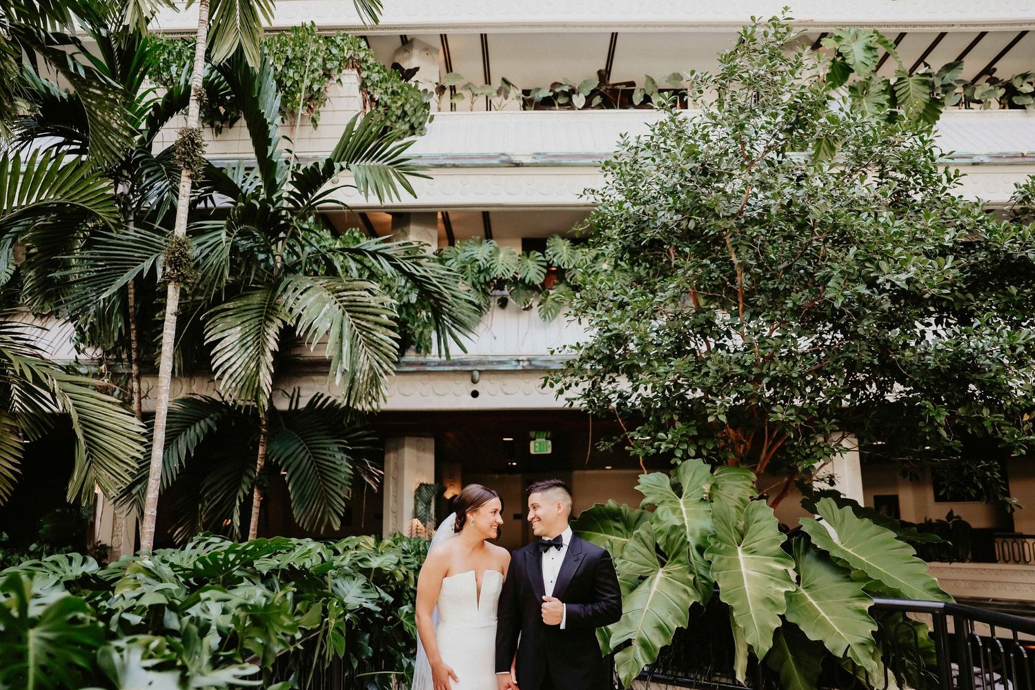A series of connected photos showing joyful outdoor ceremony moments in a lush tropical garden setting.