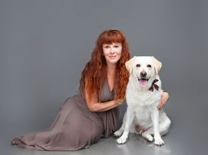Elegant holiday pet photography in Bradenton studio with Christmas decorations with pet owner