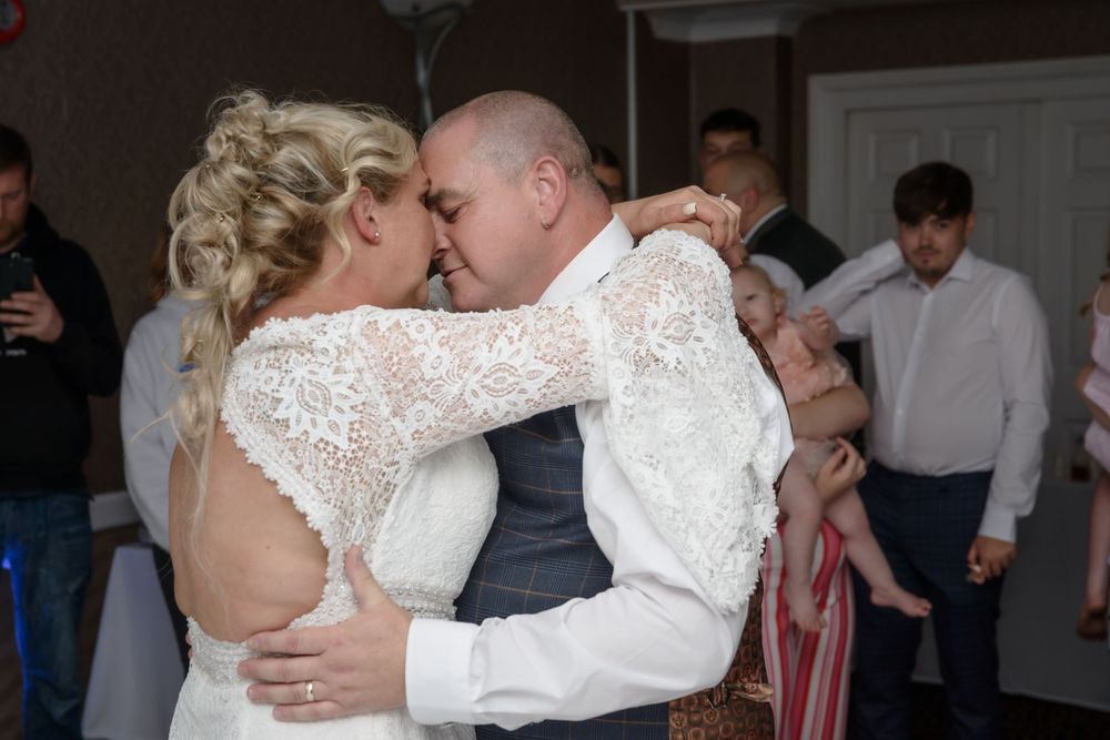 A couple shares their first dance as newlyweds in five connected wedding photos showing intimate dance moments.