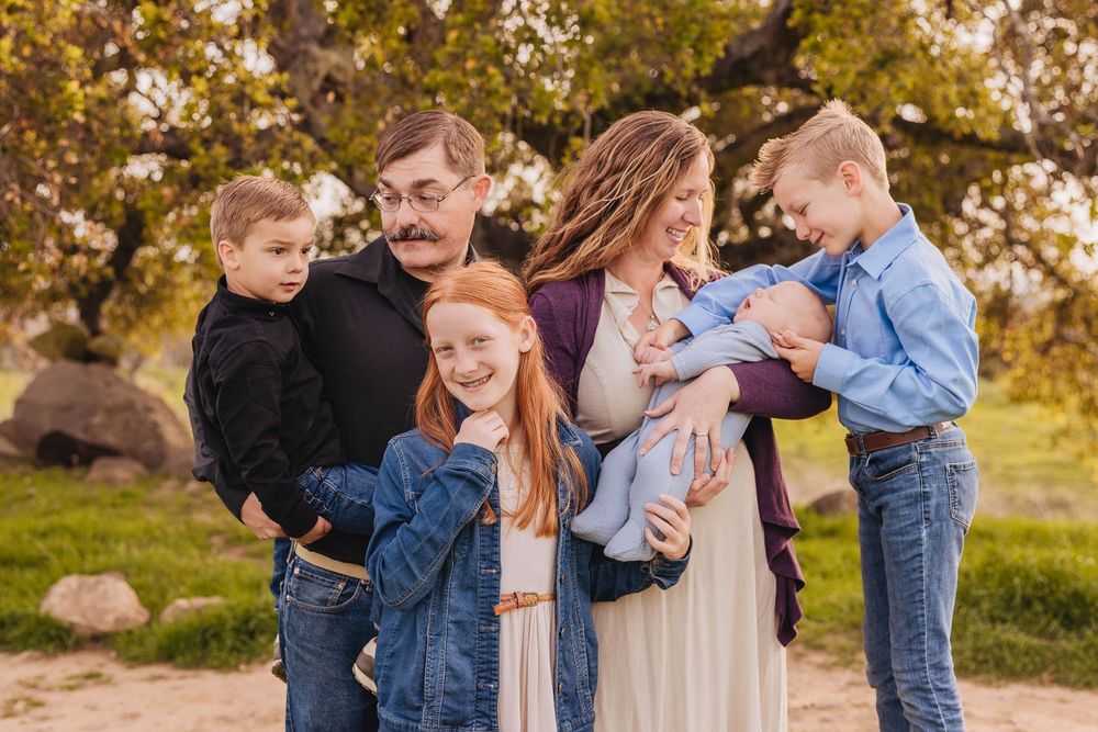 Family hiking at San Marcos Preserve in Santa Barbara during golden hour – captured by Santa Barbara family photographer