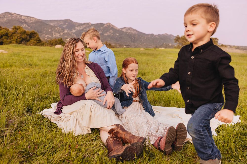 Parents and kids exploring foothills with ocean views in Santa Barbara, California