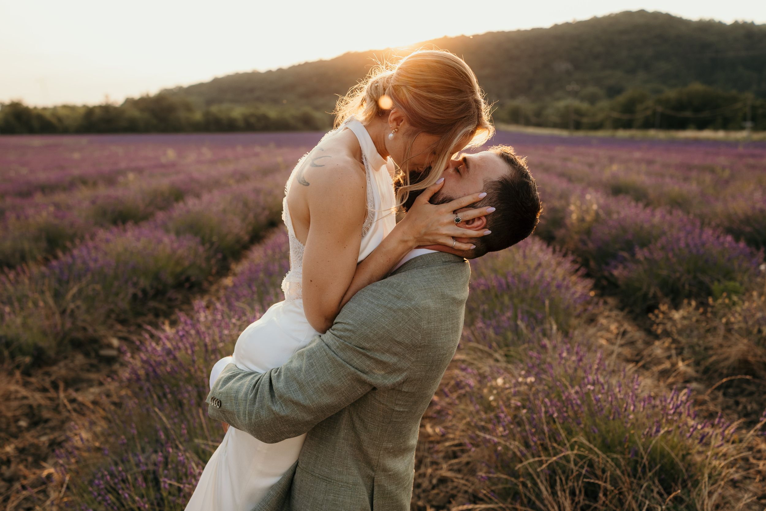 A romantic dance silhouette under stone archways with warm lighting.