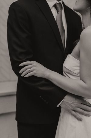 Black and white close-up shots showing details of formal wear and intimate poses.