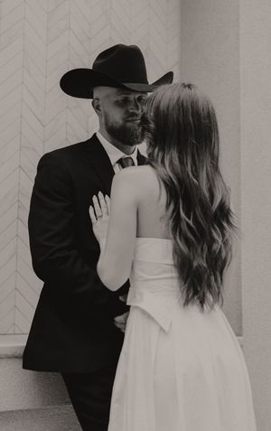 Intimate black and white photos of a couple in formal wear against a geometric patterned wall.