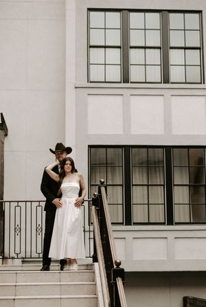 Artistic black and white wedding photography sequence on modern architectural steps.