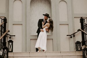 Artistic black and white wedding photography sequence on architectural steps.