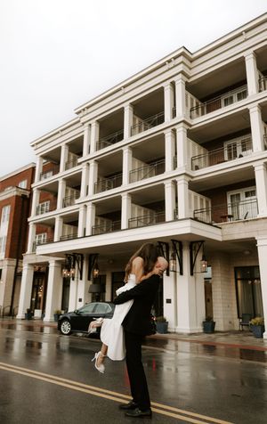 A sequence of photos showing a couple walking along a covered outdoor walkway of a modern building.